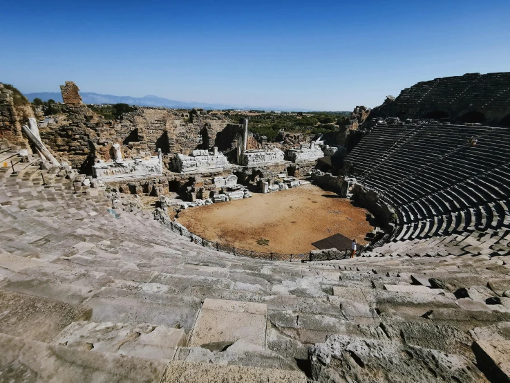 there is a very large ampulated stadium and a huge rock outcropping