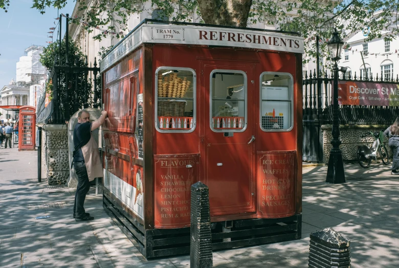 the food truck has people walking by it