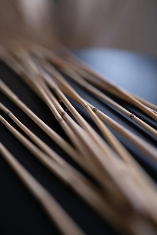 a close up of many brown sticks with small tooth picks