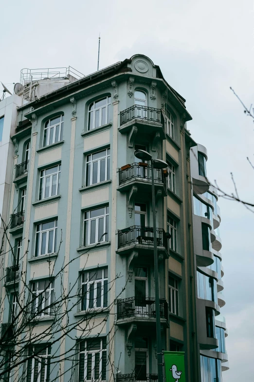 a very tall building with lots of balconies