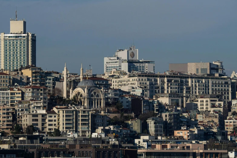 a view of city from the top of a hill