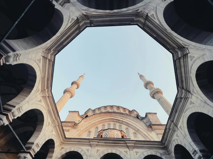 a view looking up into an old building that is in a courtyard