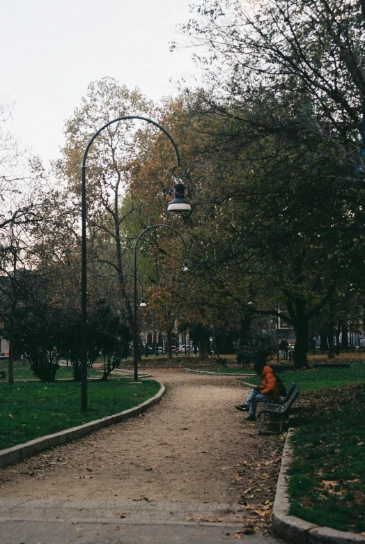 there is a person sitting on the bench