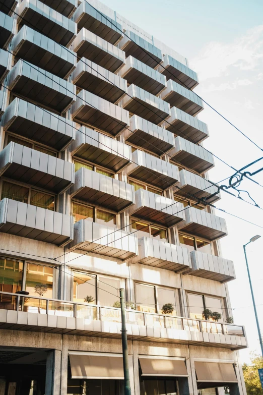 an apartment building with balconies on the second floor