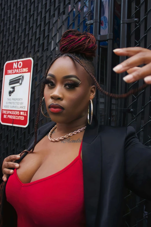 a woman with red makeup is posing in front of a no passing sign