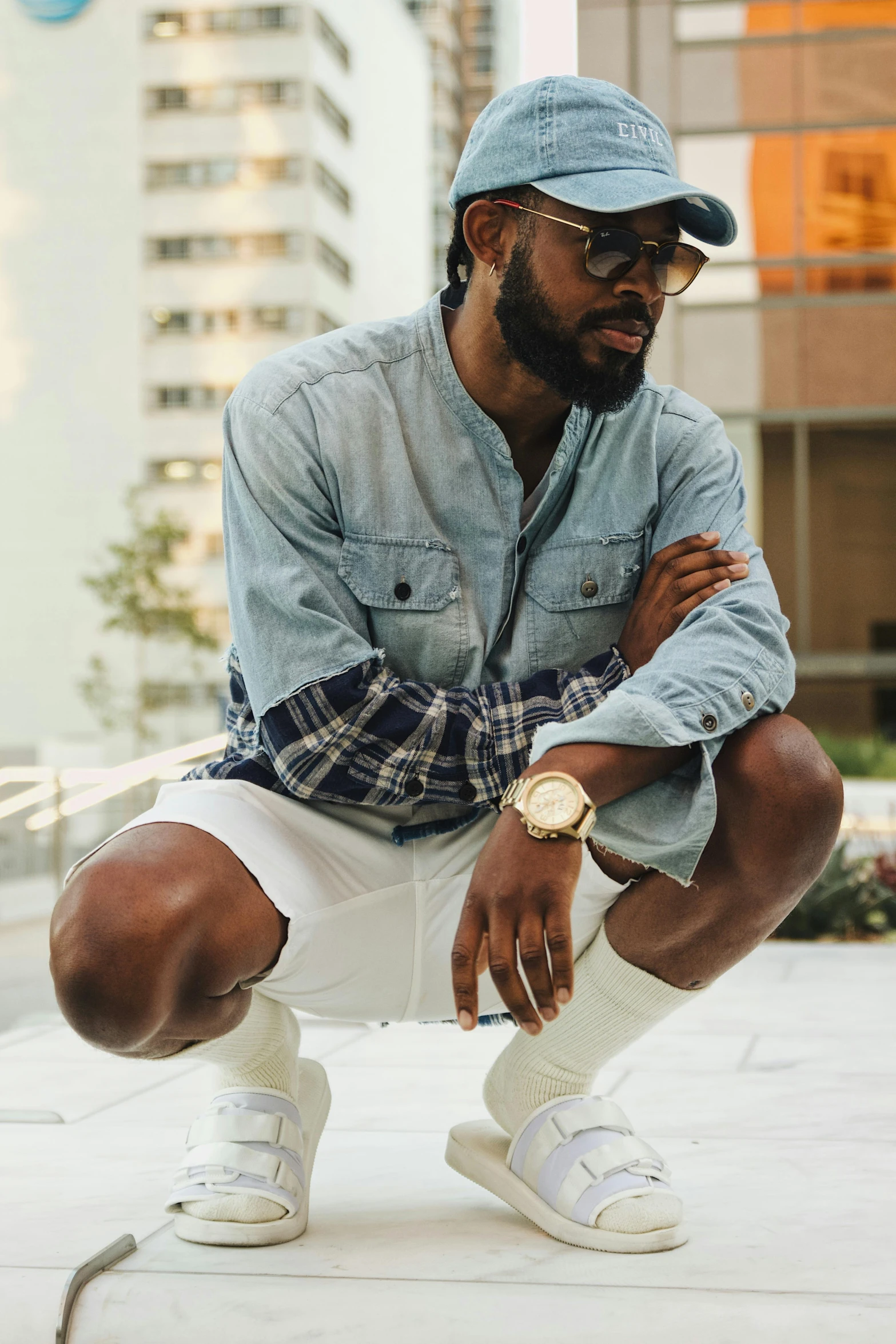 a man squats down while leaning against his knees