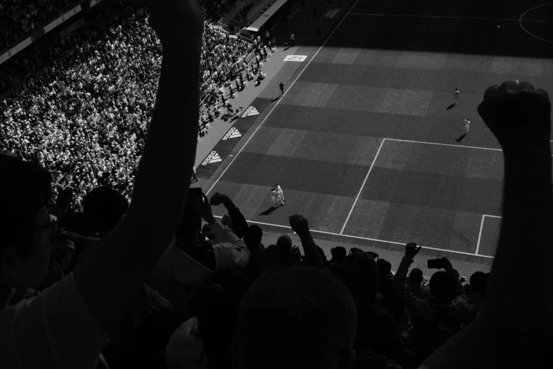 a tennis match is being played in a stadium with an audience