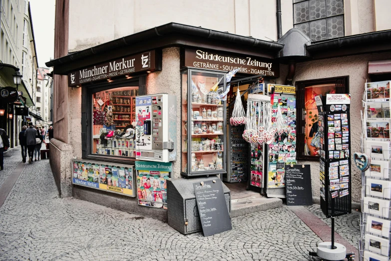 a store front on the corner near a sidewalk