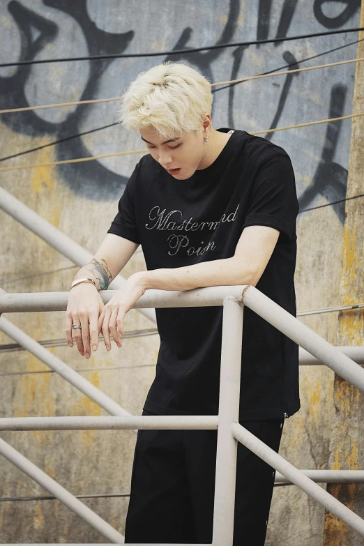 an image of a male standing on a stair case