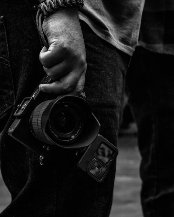 a man with a camera on his arm