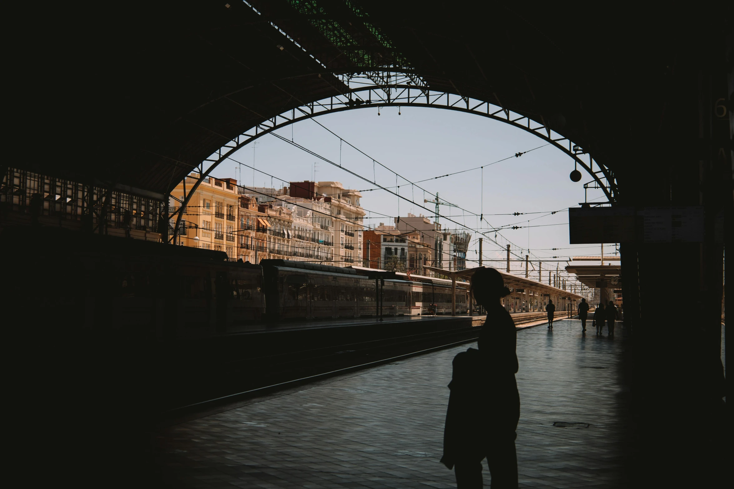 a silhouette of a person with a suit and umbrella