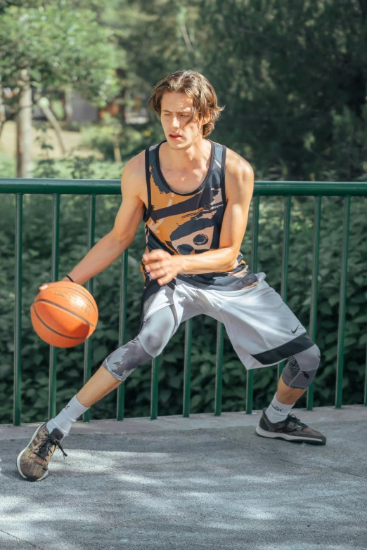 a man with  holding a basketball