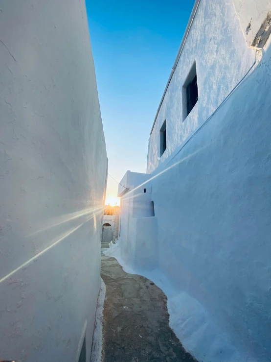 the sun shining brightly through the windows of this small village