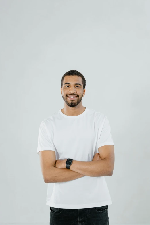 a man with a beard and white shirt on posing for a po