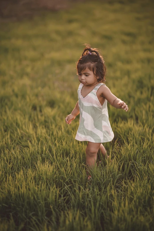 a small child in a field of grass