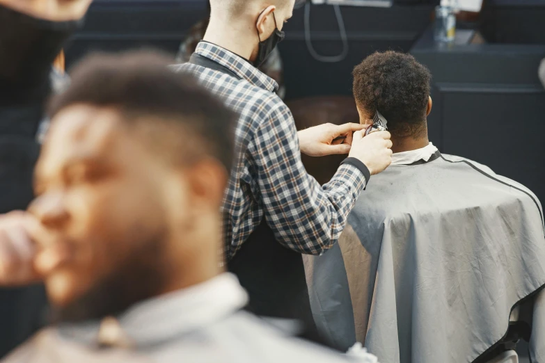 a man  his own hair with a large comb