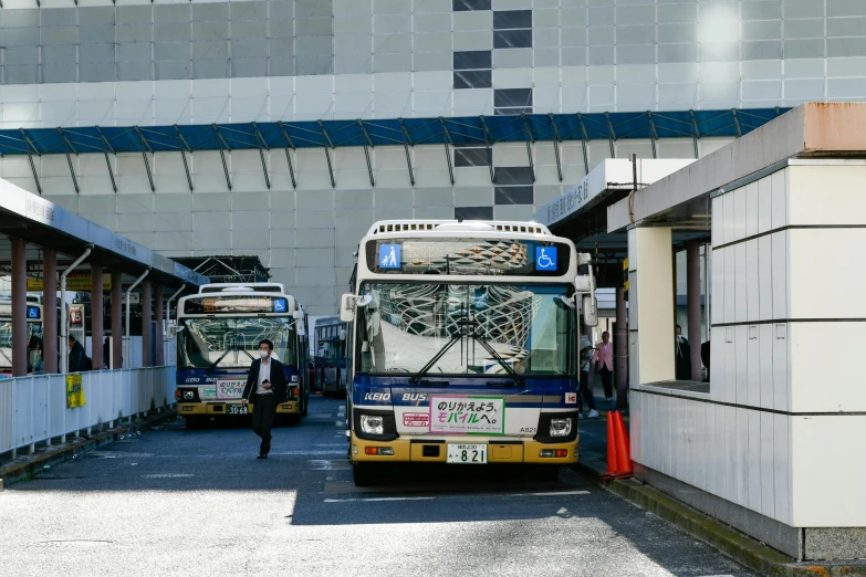 busses parked in a lot next to each other