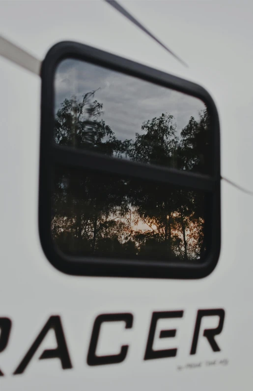 a rear view mirror sitting on the side of a white truck