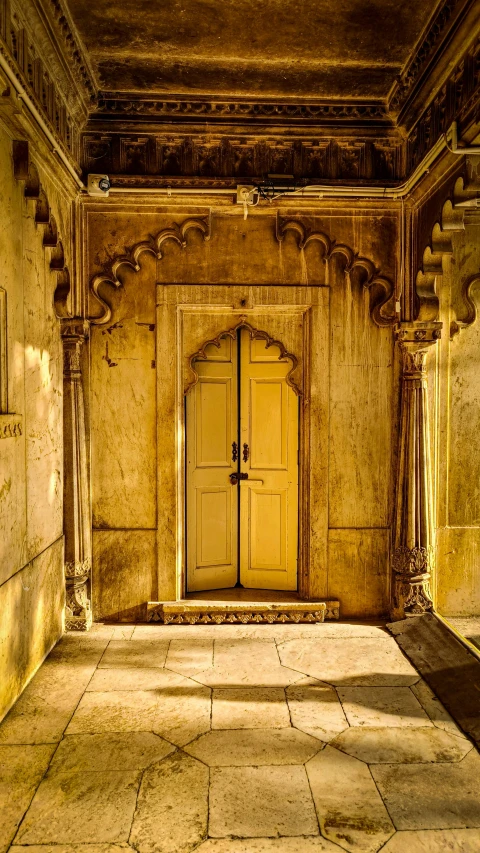 an empty hallway with a doorway that leads into another room