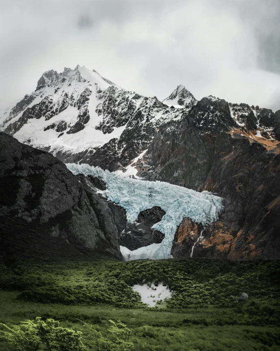 the mountains covered with snow are filled with ice