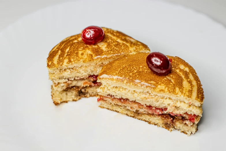 a white plate topped with cut in half pancakes