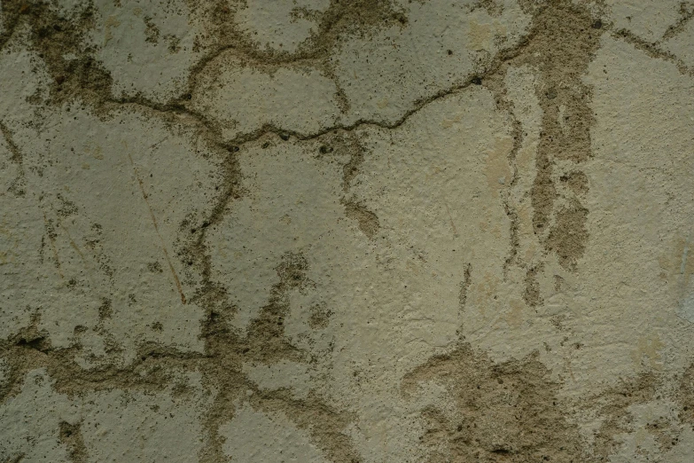some dirty cement walls with some brown marks on it