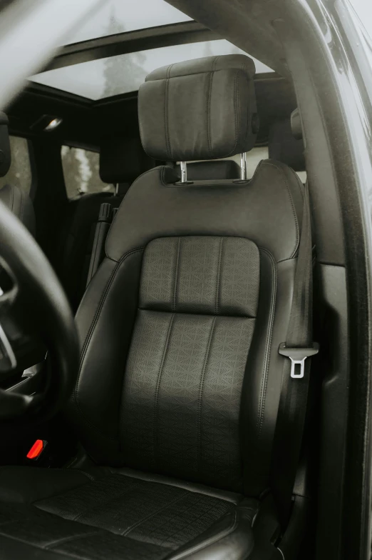 a black and white po of the back seats of a car