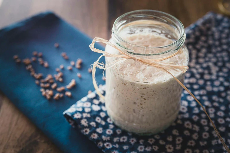 the small glass jar has a few spices in it