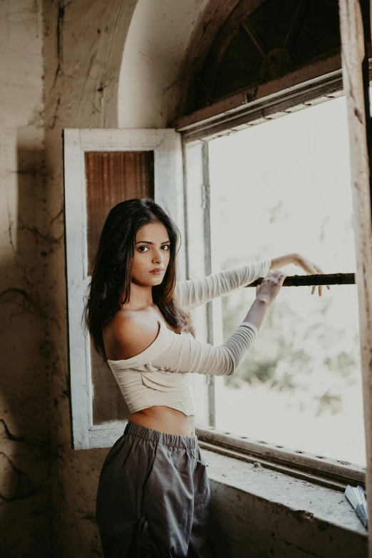 a woman is taking a selfie in the window