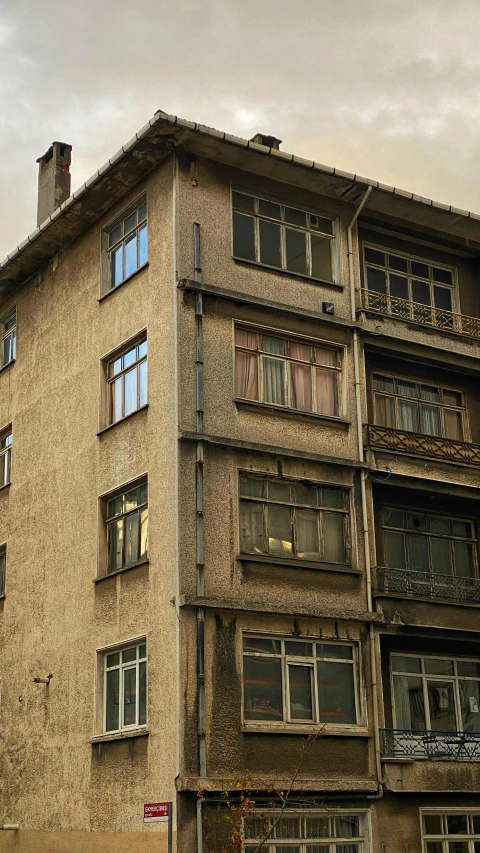 a large old wooden building with lots of windows