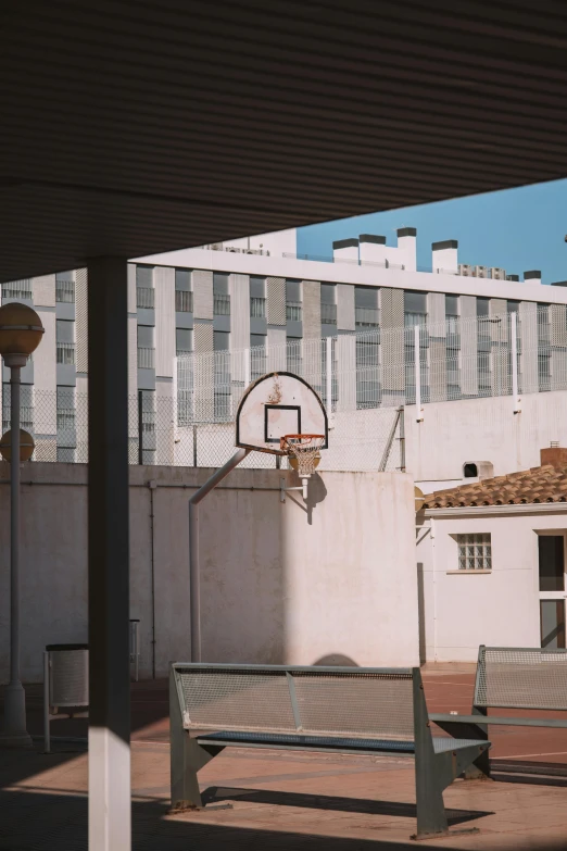 the basketball hoop is in a very large building