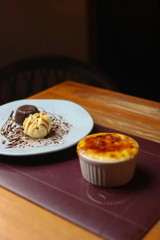 some dessert on a white plate and some brown food