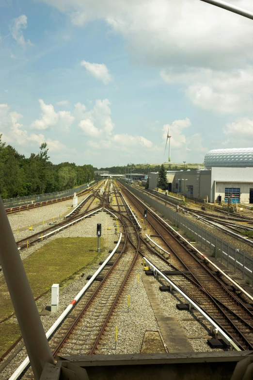 a view from a train station looking at the tracks