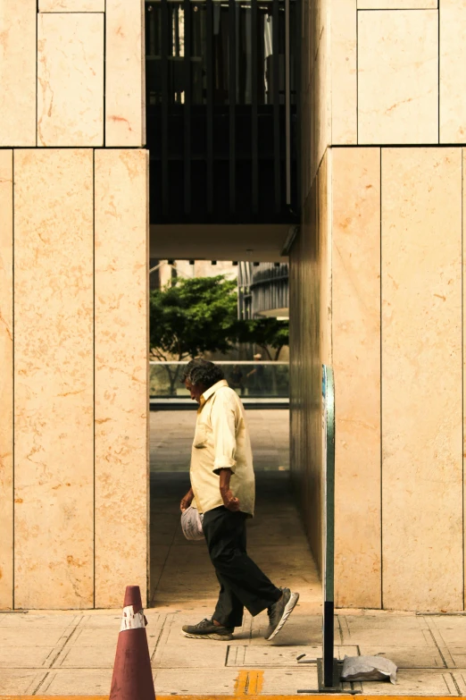 a person walking past an open door on a city street