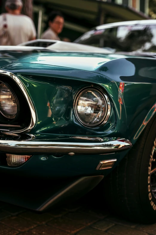 green mustang co is parked at the corner of the road