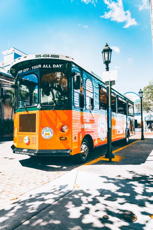 a transit bus parked at the side of the road