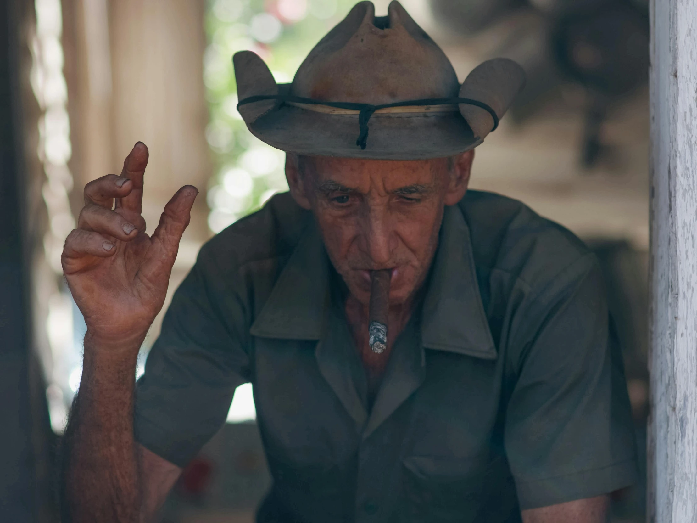 a man sticking his tongue out making the v sign