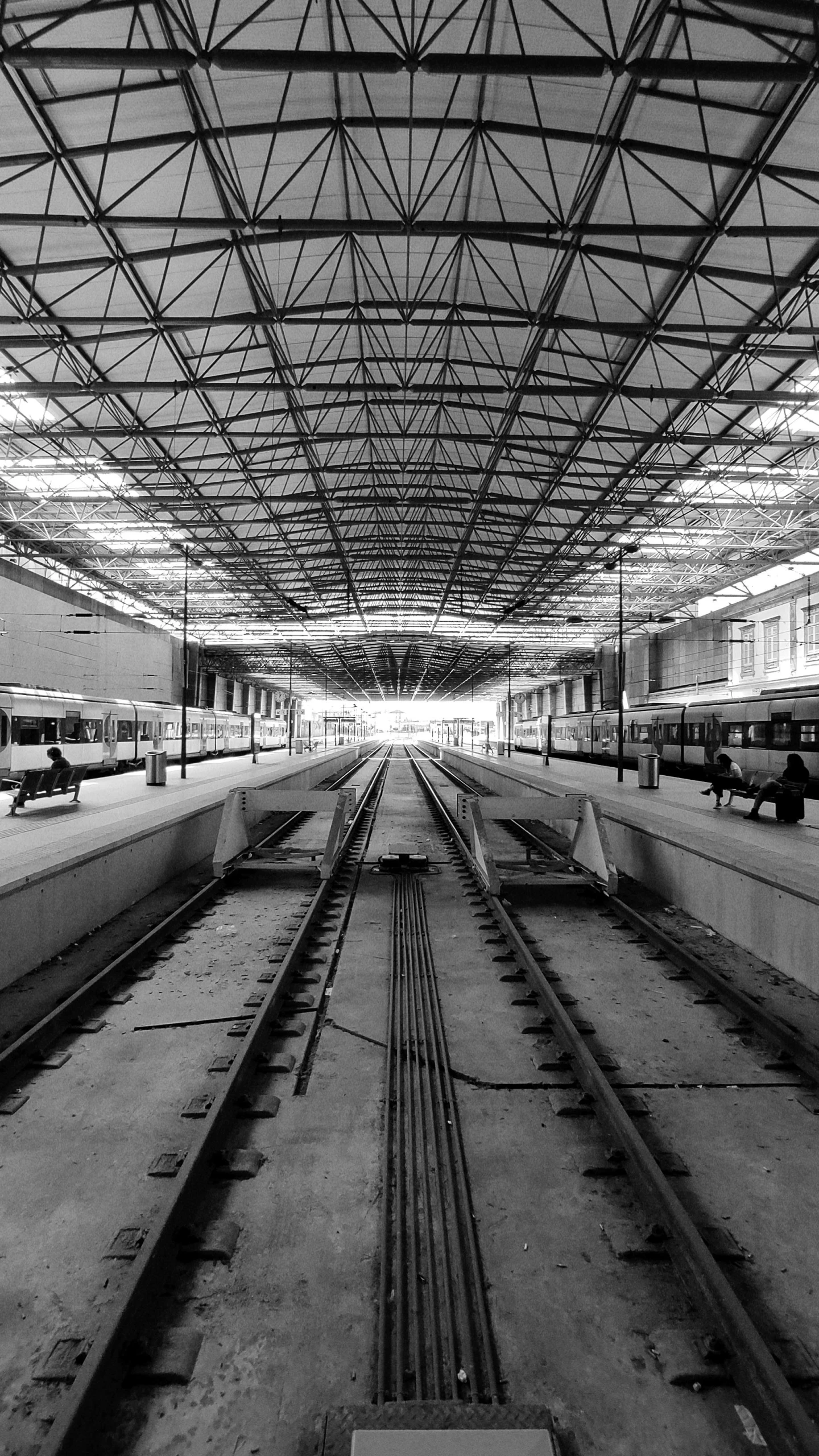 an empty train station with multiple tracks