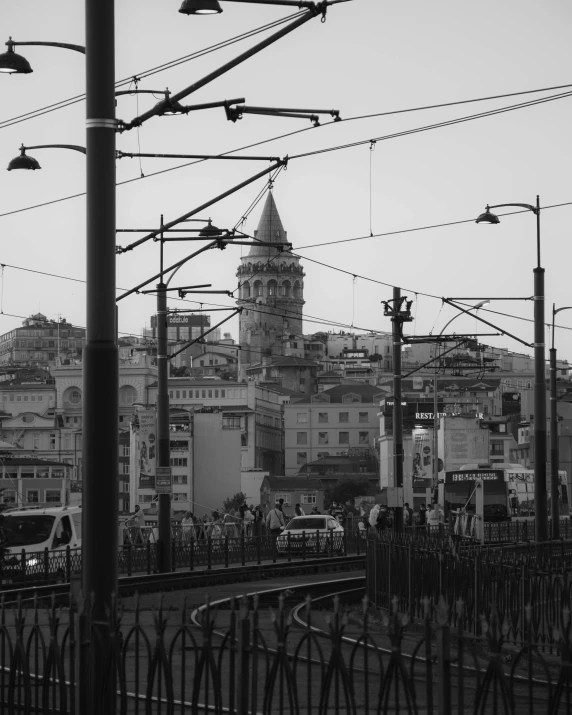 a large cathedral towering over a city under lots of wires