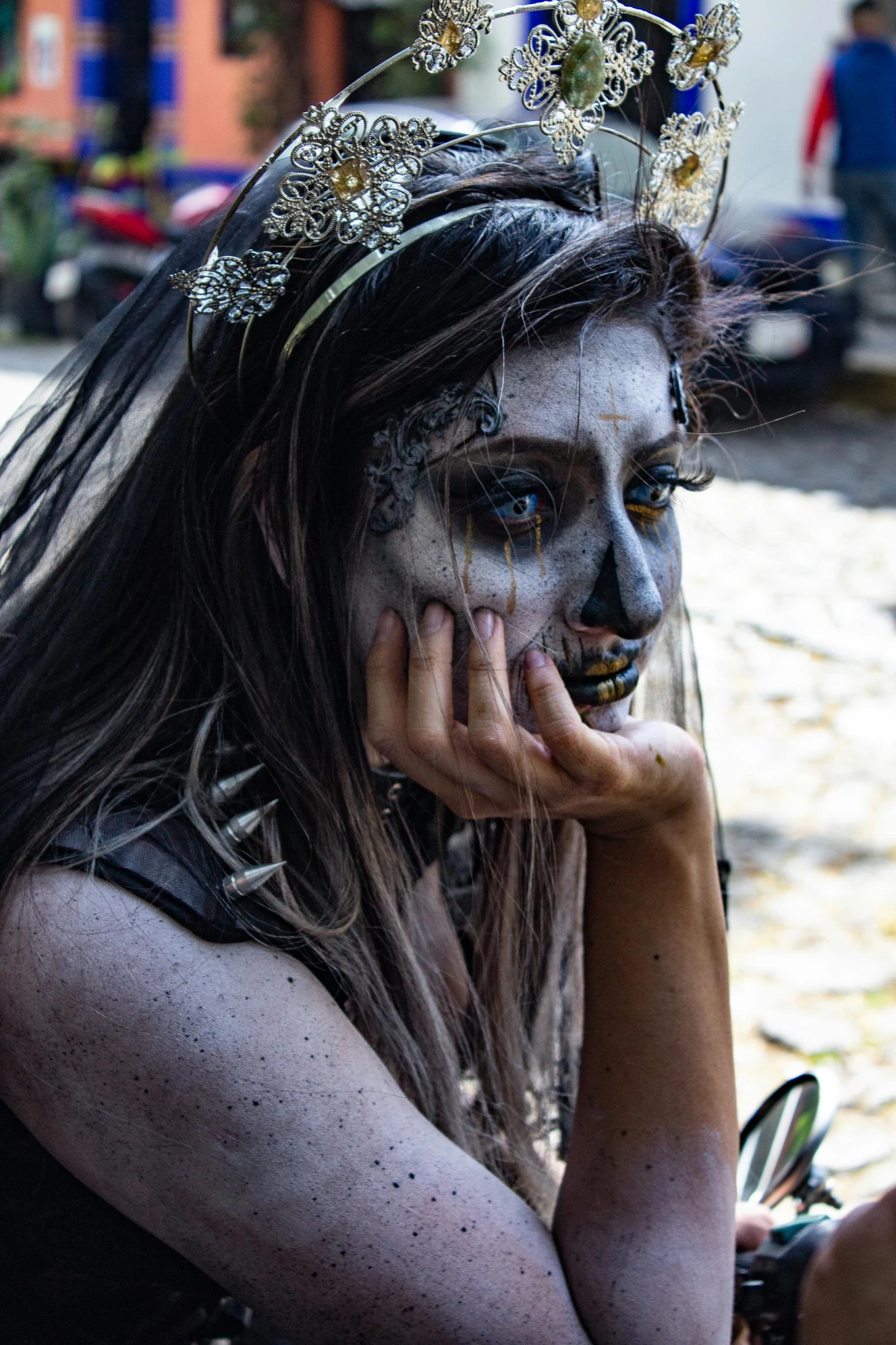 a woman with makeup all over and head dress