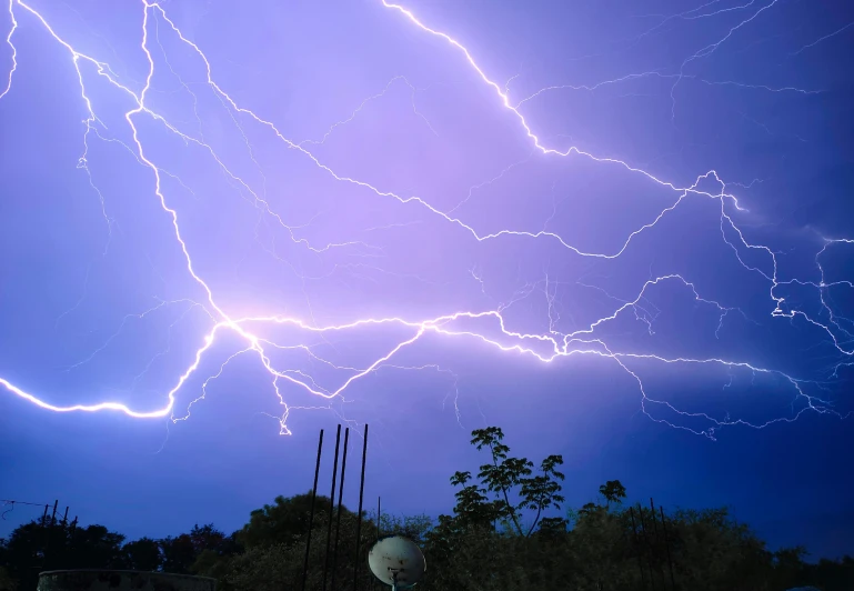 a cloud filled with purple sky with lightning