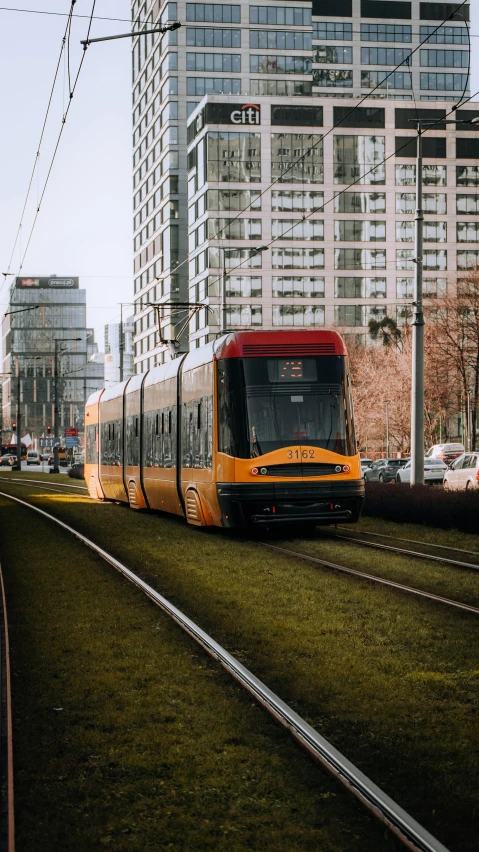 a train is going down a track in a big city