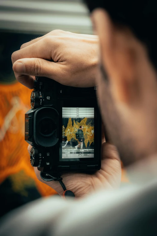 a man taking a picture of himself with his camera