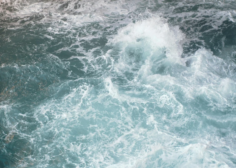 closeup view of white foam on the waves