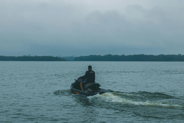 a man in the water riding on a jet ski