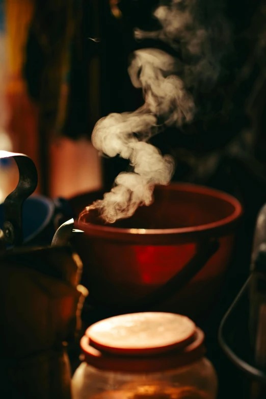 steam rises from a bowl on the stove
