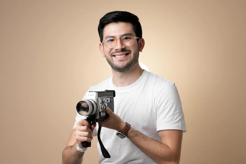 a man holding a camera taking a picture