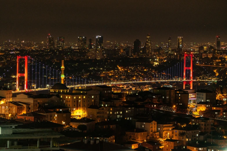 a nighttime view of some very tall buildings in the city