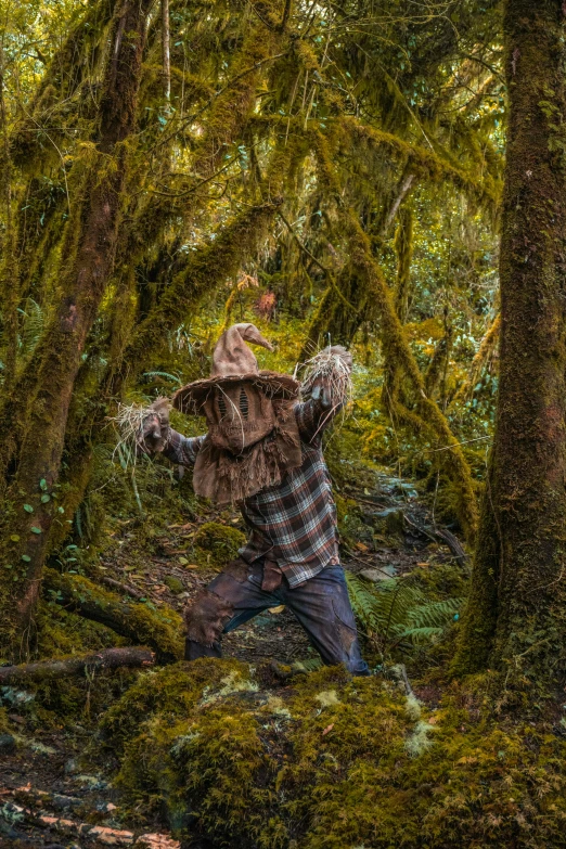 a man on his back in a forest