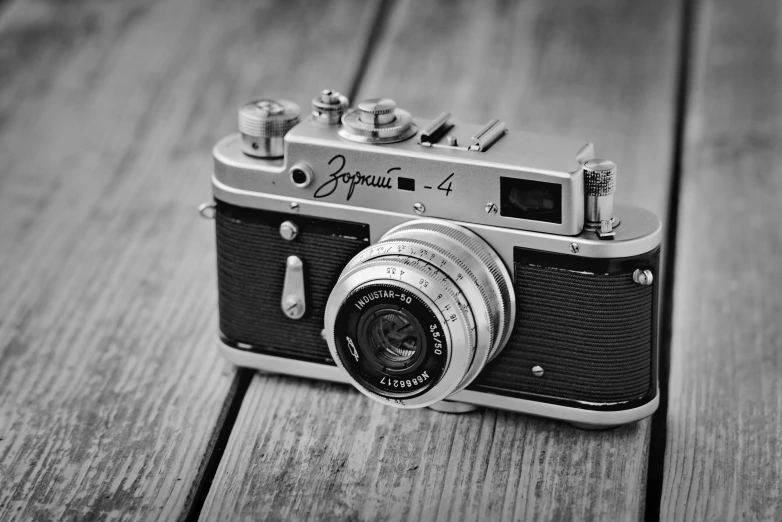 an old camera sits on top of a table